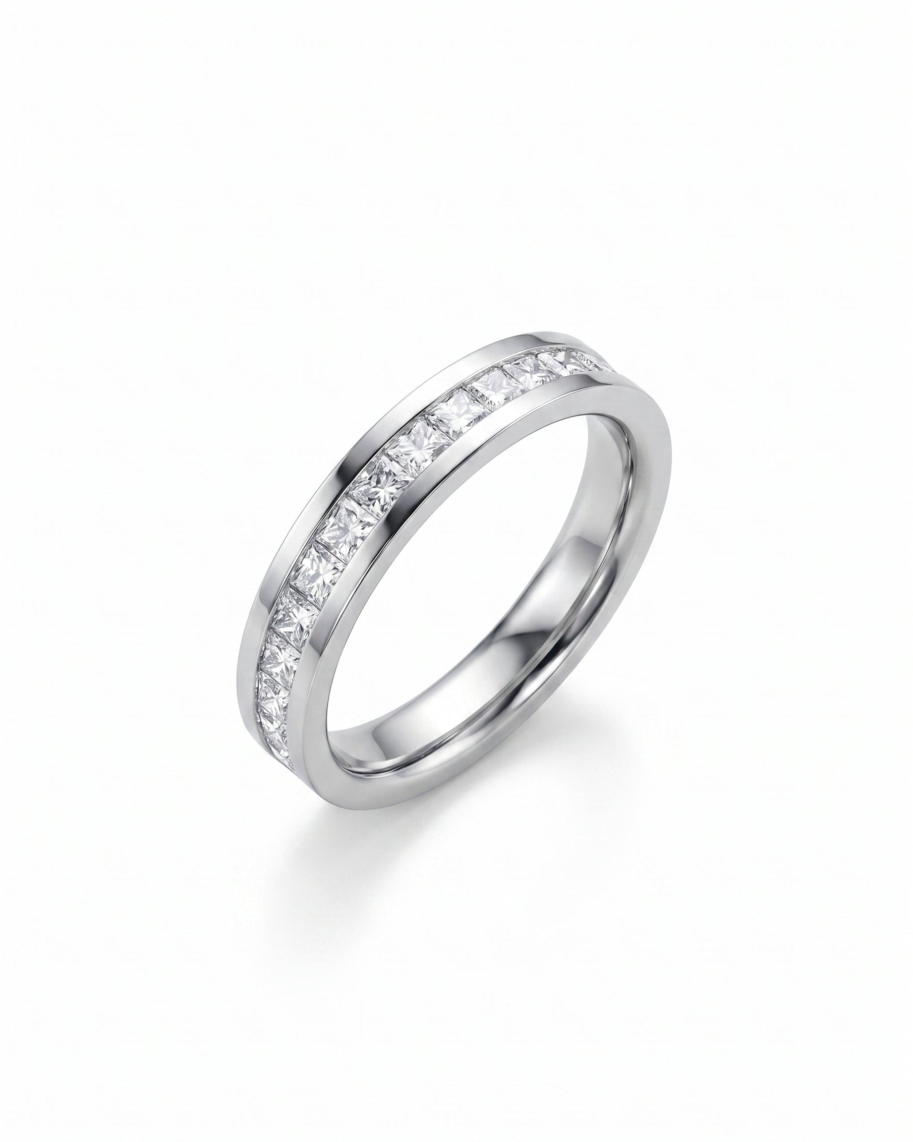 Silver eternity ring with princess cut channel set diamonds.