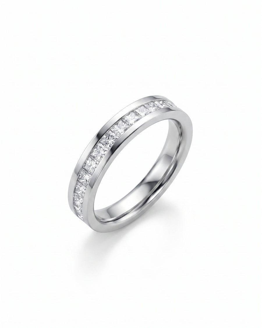 Silver eternity ring with princess cut channel set diamonds.