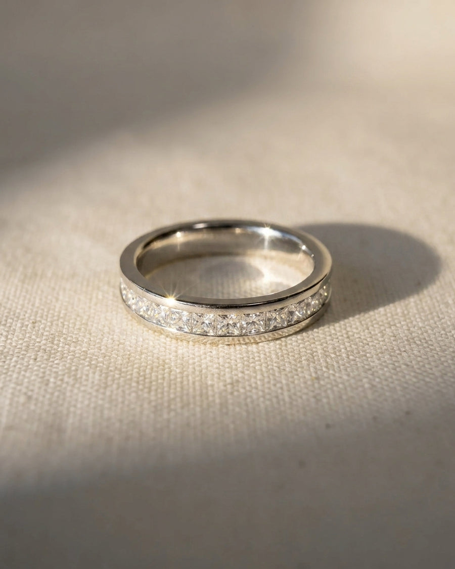Silver princess cut channel set diamond eternity ring.
