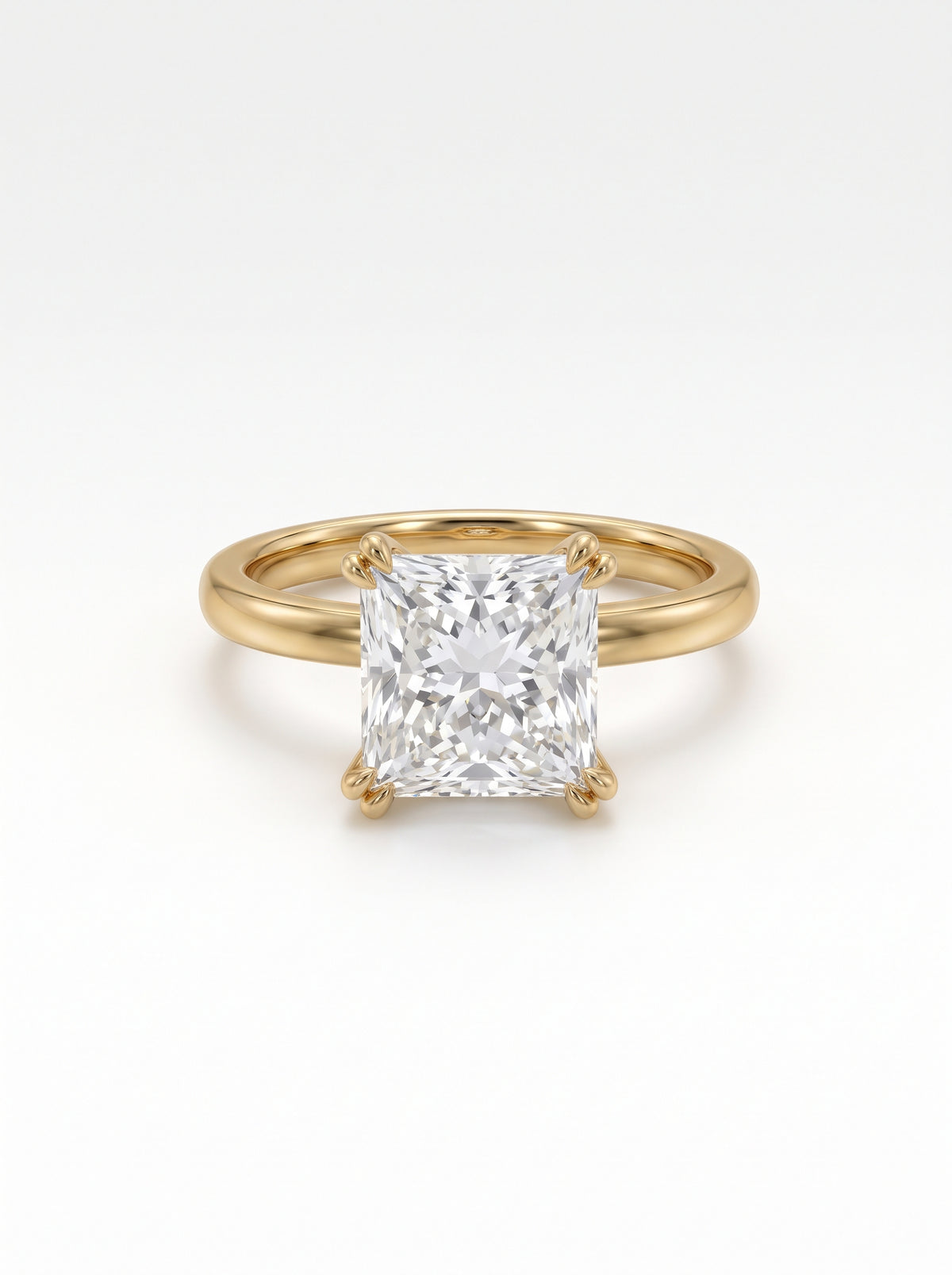 Princess cut diamond engagement ring with a hidden halo set in a polished yellow gold band.