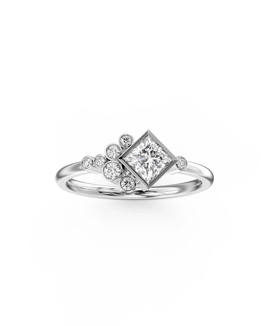 Silver princess cut diamond engagement ring with bubble accents.