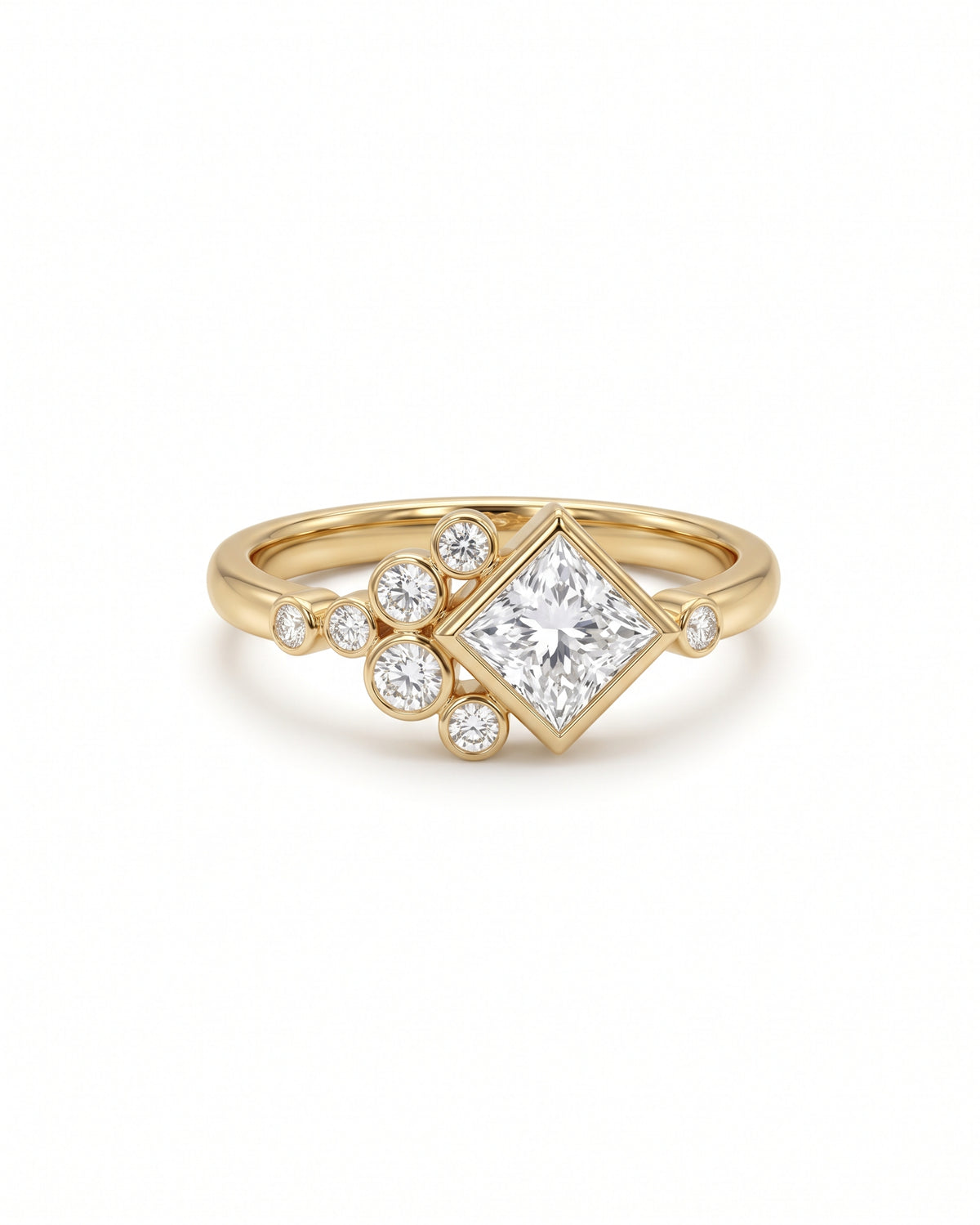 Gold engagement ring featuring a princess cut center diamond and a cluster of small round accent diamonds.