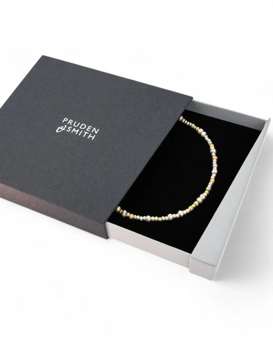 Silver and gold nugget necklace with organic beads in a black jewelry gift box