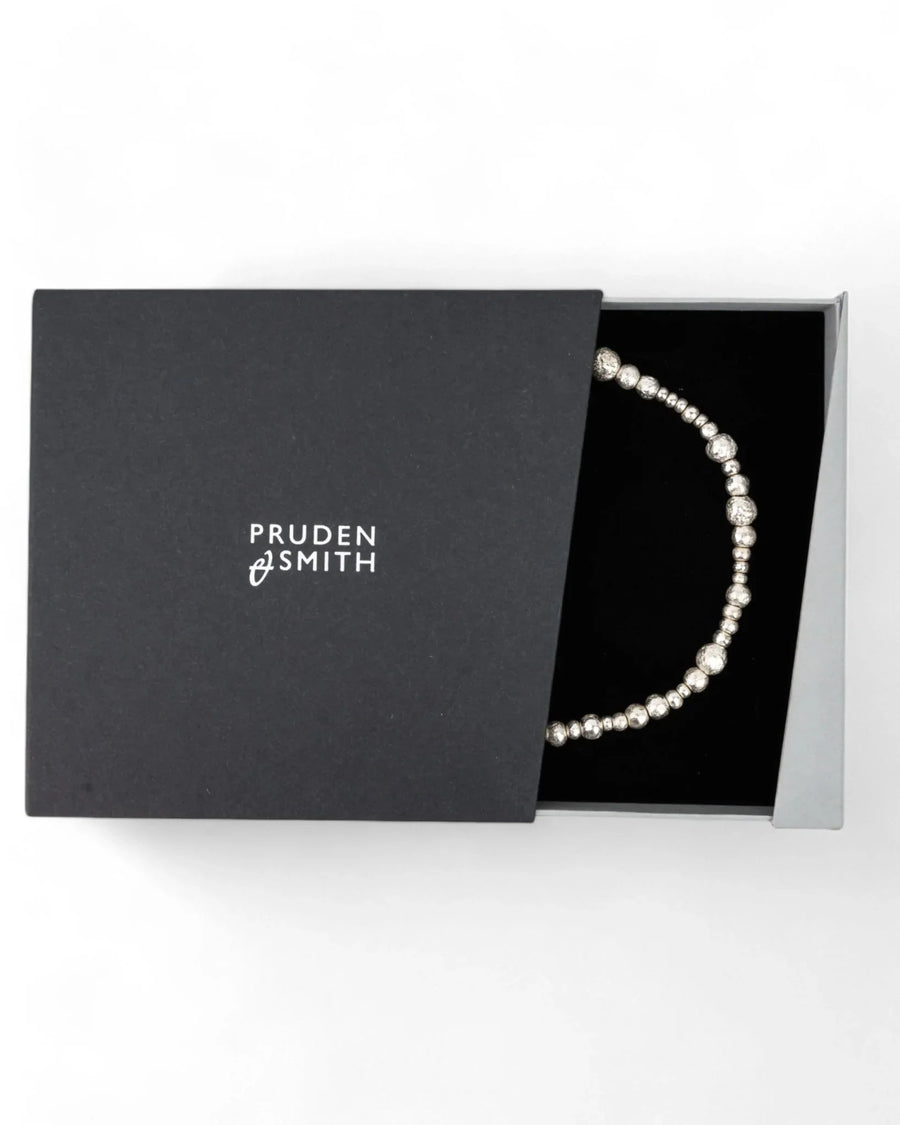 Textured silver nugget necklace in gift box on white background