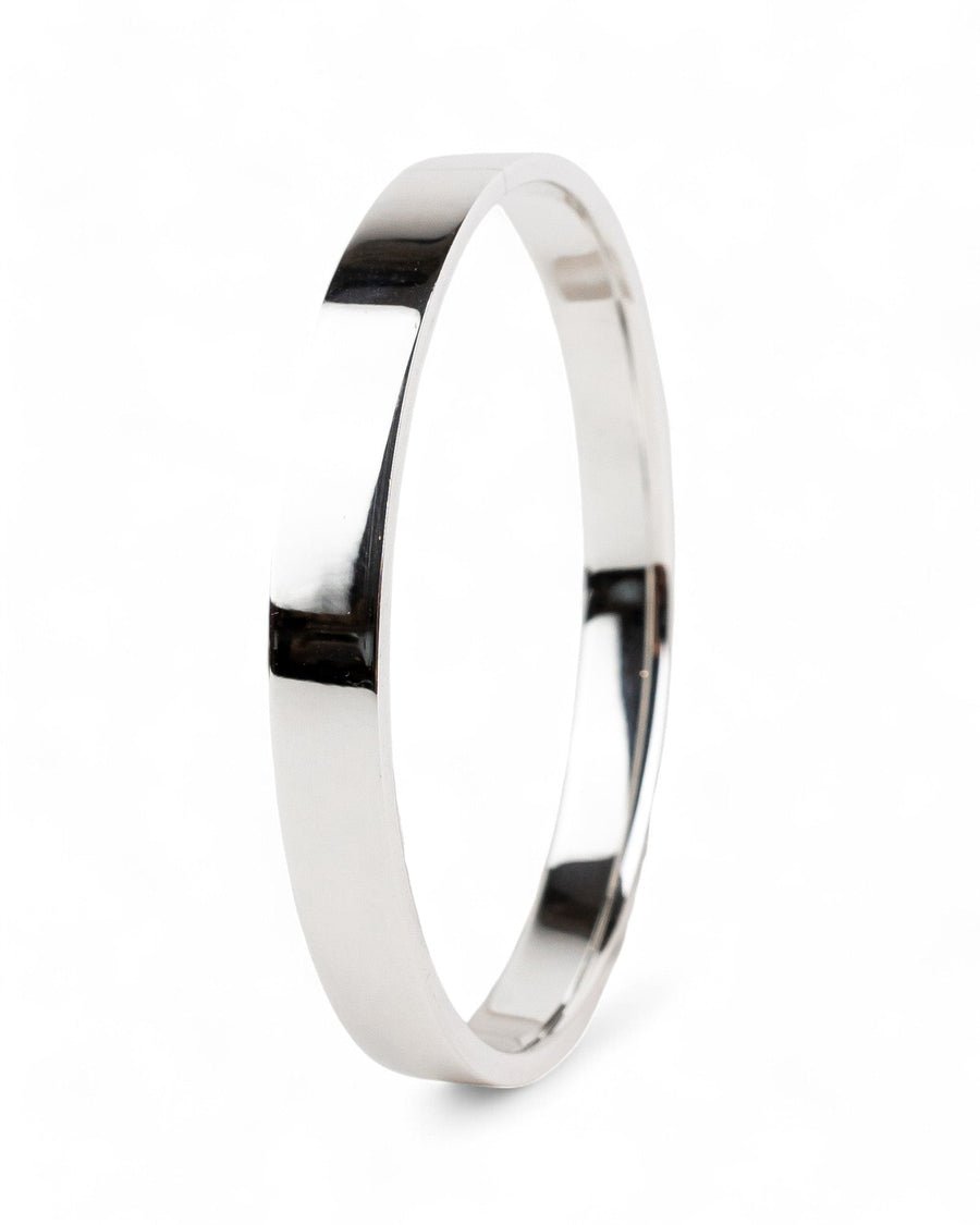 rectangular solid silver bangle with smooth polished finish on white background
