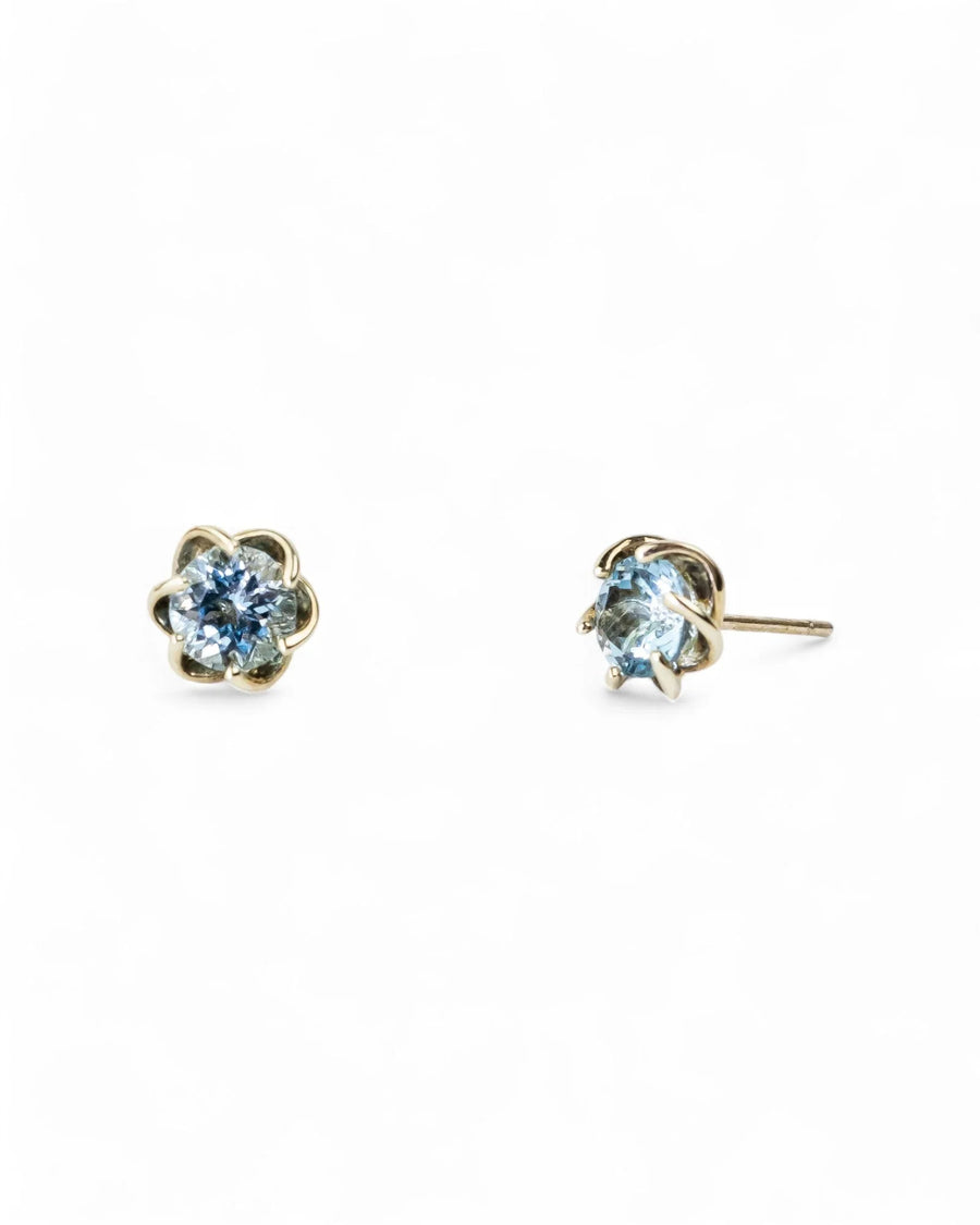 9ct white gold stud earrings with vivid aquamarine gemstones in a revolved claw design.
