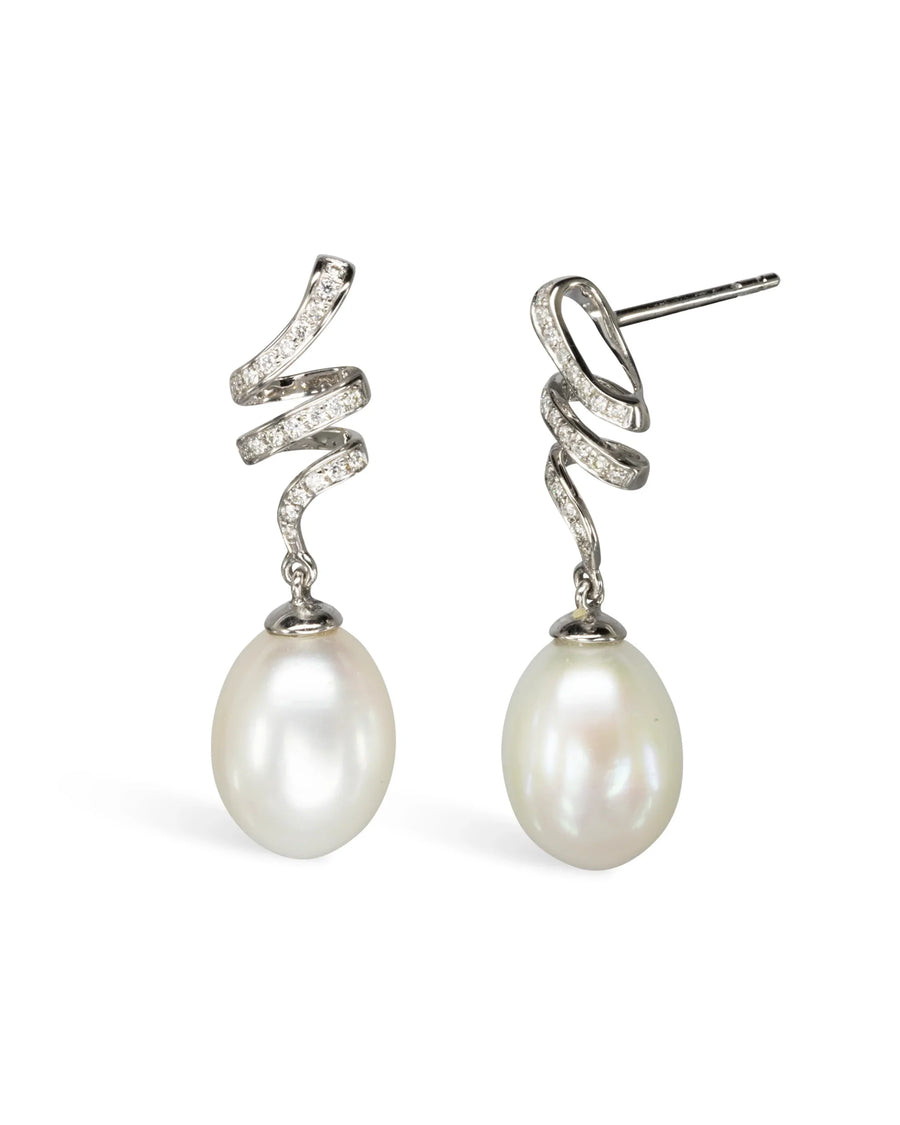 Diamond swirl pearl drop earrings with organic shape and silver setting
