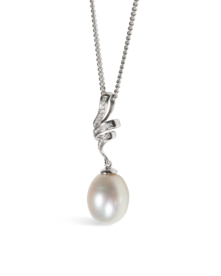 White gold pendant necklace with swirling diamond detail and single drop pearl