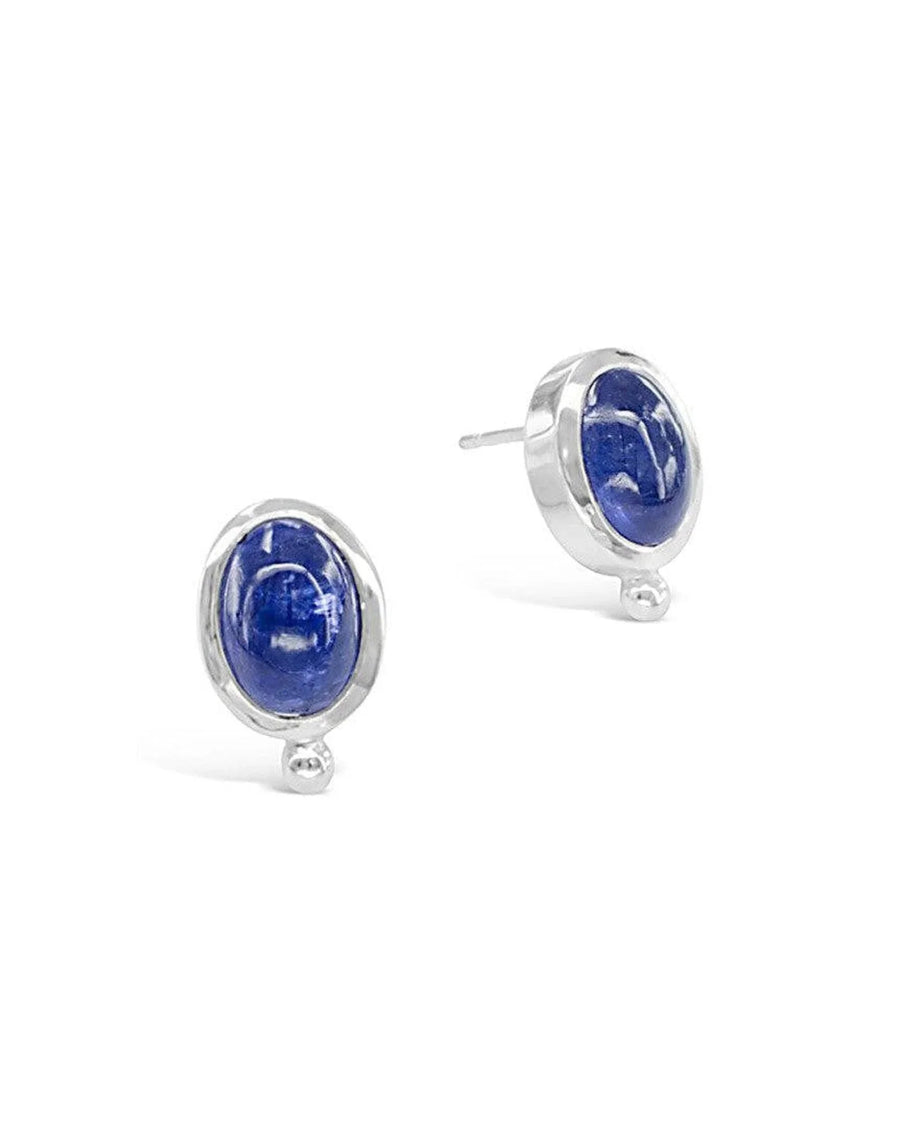 Handmade silver stud earrings with oval tanzanite gemstones on white background