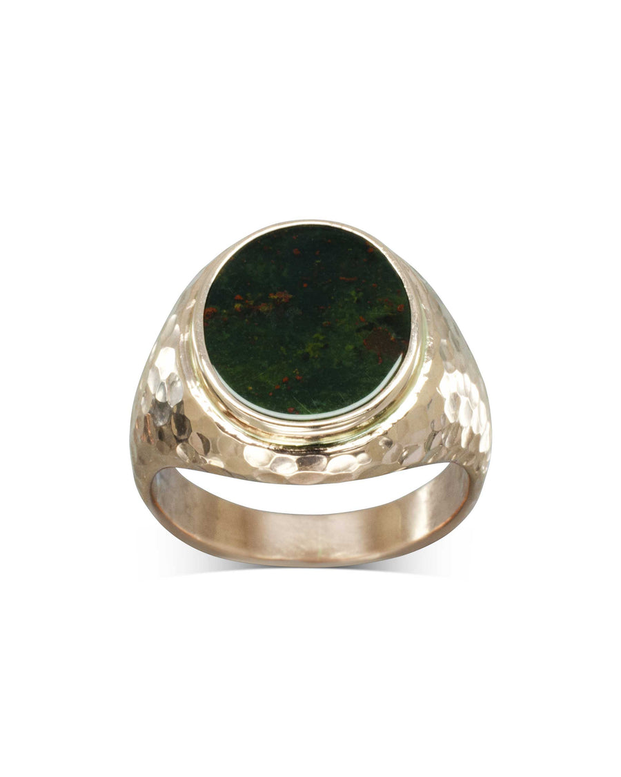 Rose gold signet ring with a hammered band and an oval green bloodstone.