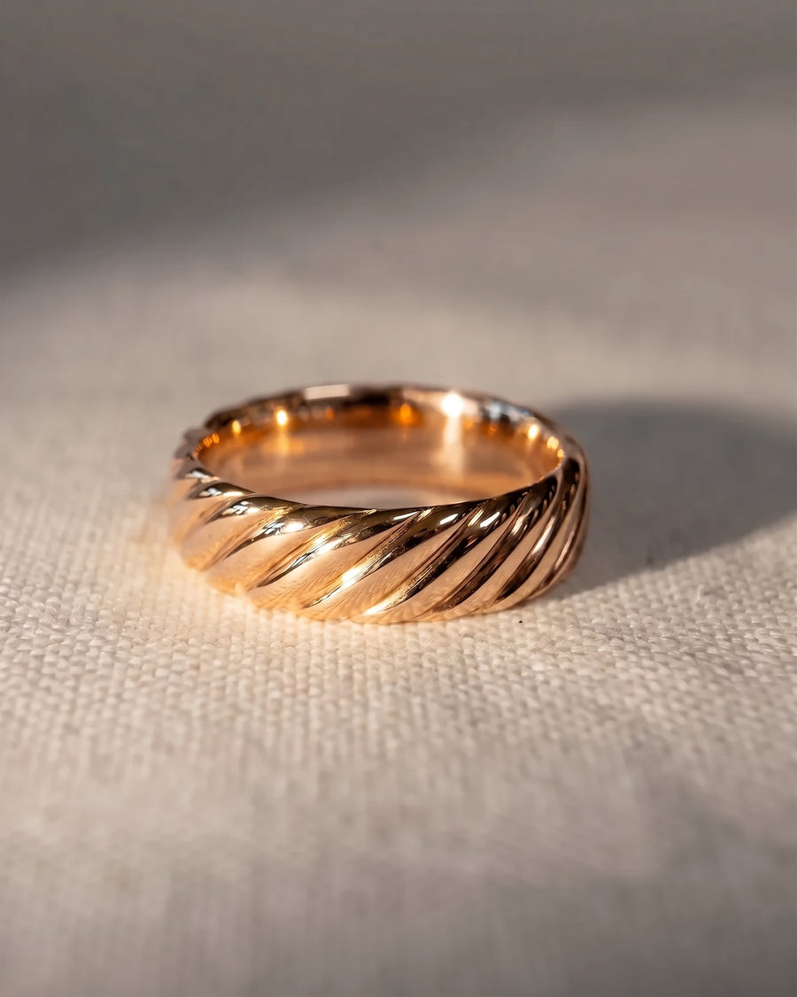 rose gold twisted mens wedding ring - material shot