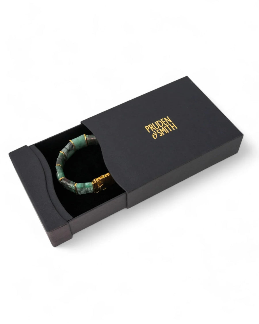 Rough Brazilian emerald bracelet with gold accents in a black gift box