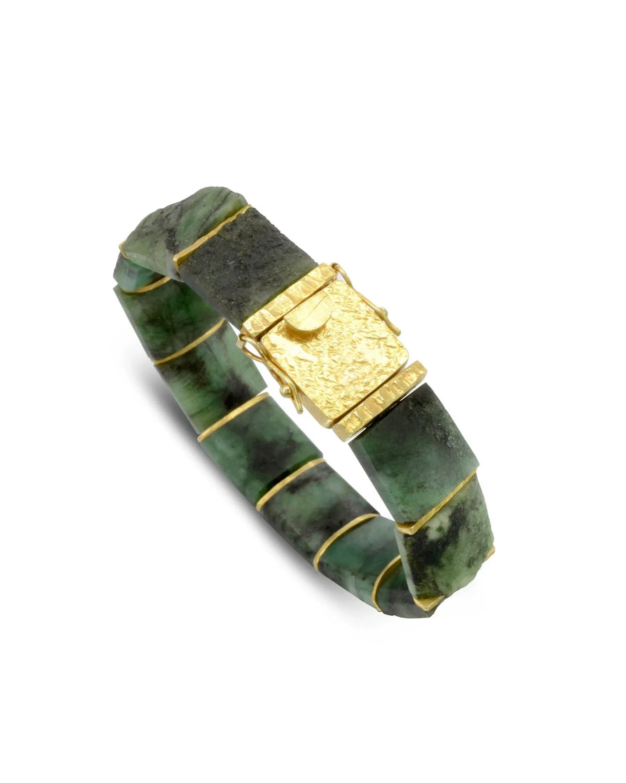 Chunky rough emerald bracelet with gold textured clasp and natural green stone segments