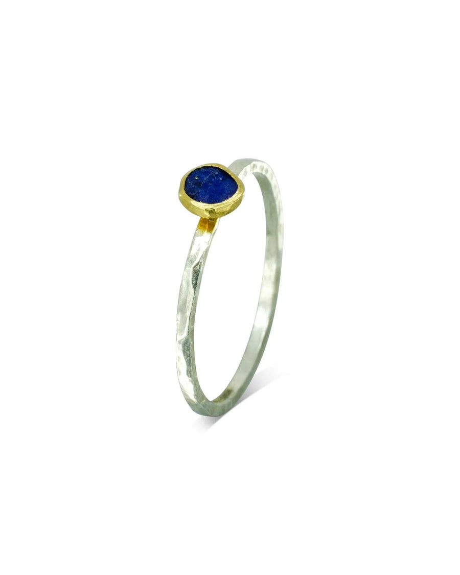 Handmade stacking ring with rough-cut lapis lazuli in gold bezel on textured silver band