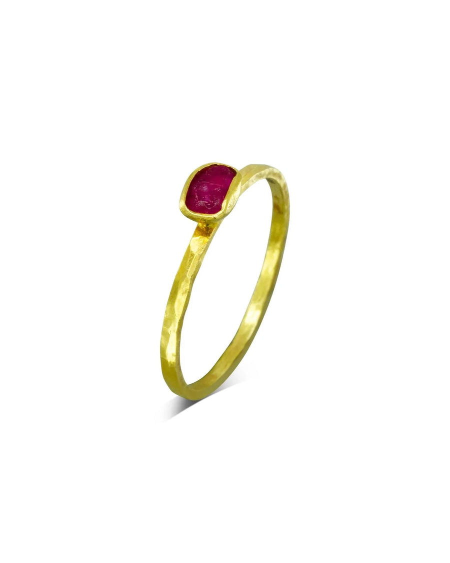 Handmade gold stacking ring with raw cut ruby and organic hammered texture