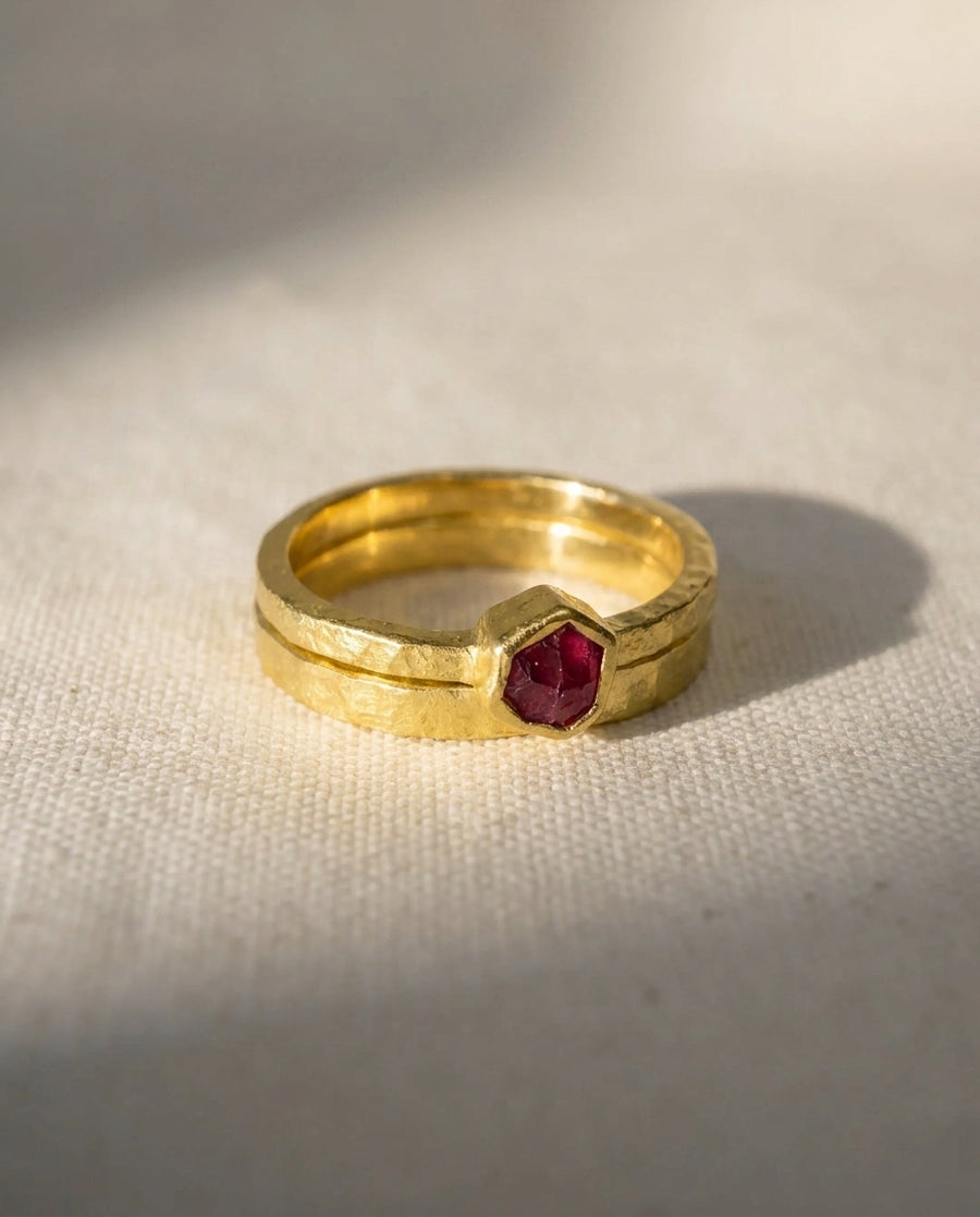 18ct yellow gold ring with a rough cut hexagonal ruby.