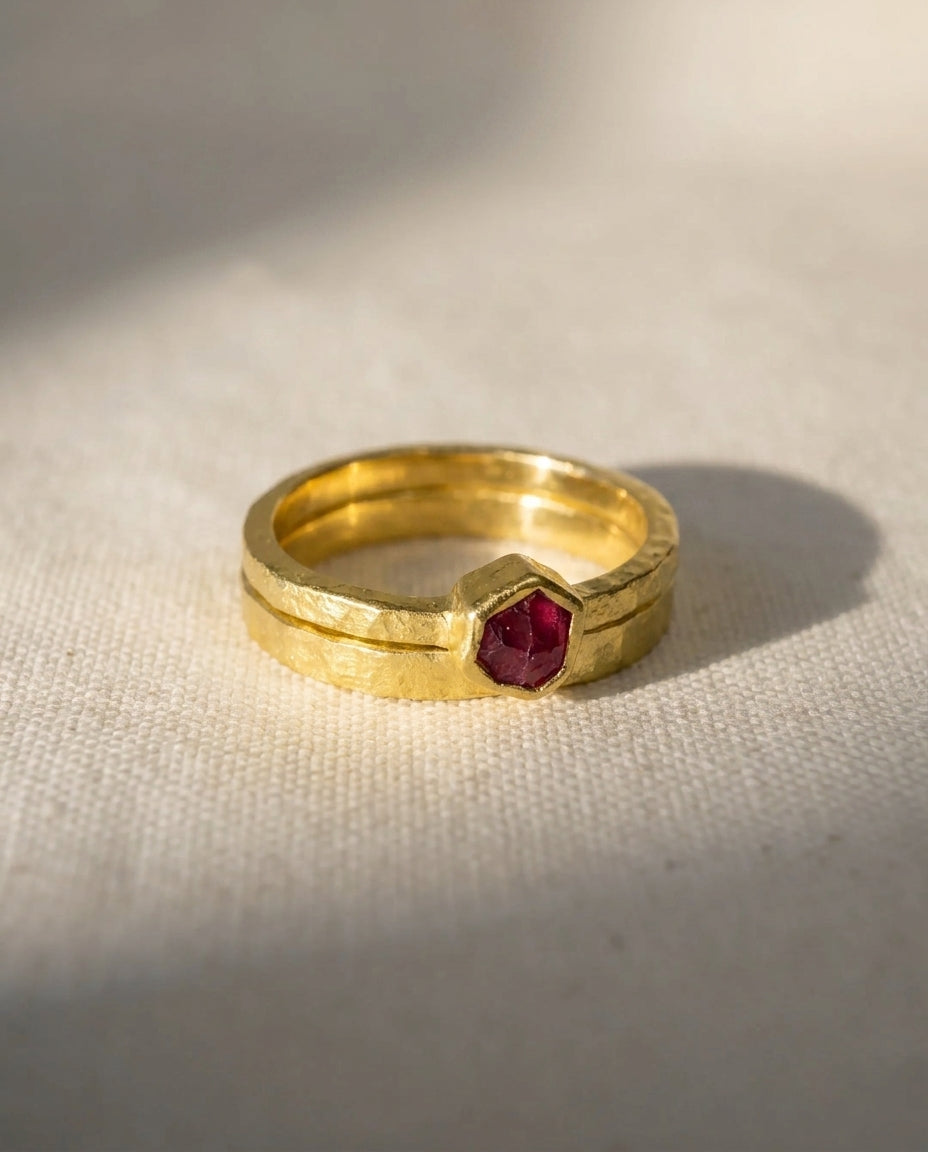 18ct yellow gold ring with a rough cut hexagonal ruby.
