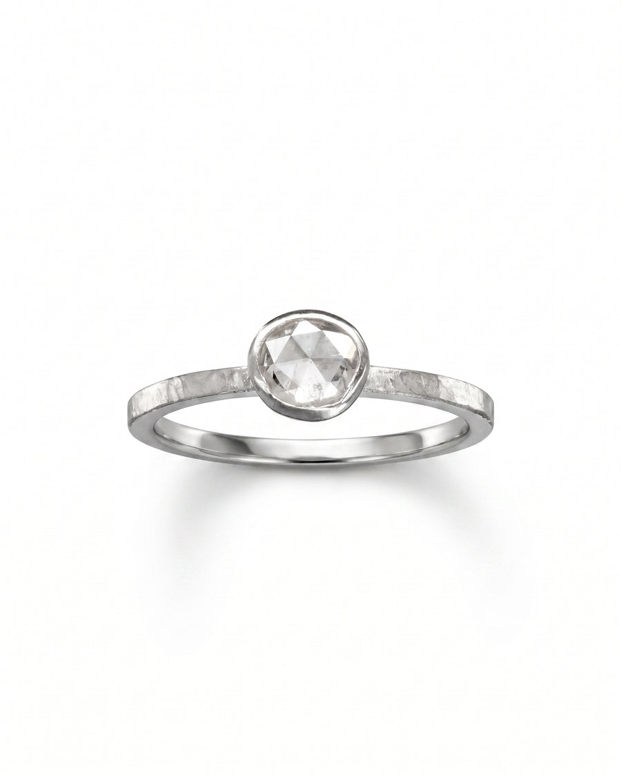Silver ring with an oval rough diamond.