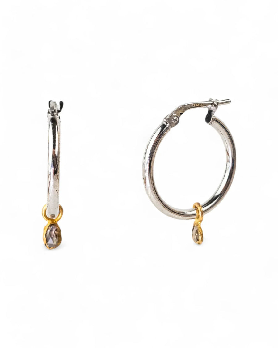 Silver hoop earrings with rough diamond drops.