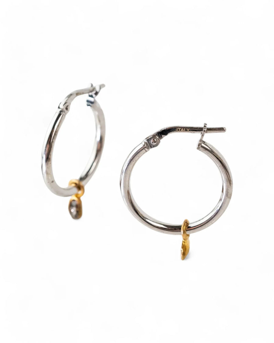 Silver hoop earrings with a small yellow gold vermeil charm and rough diamond.