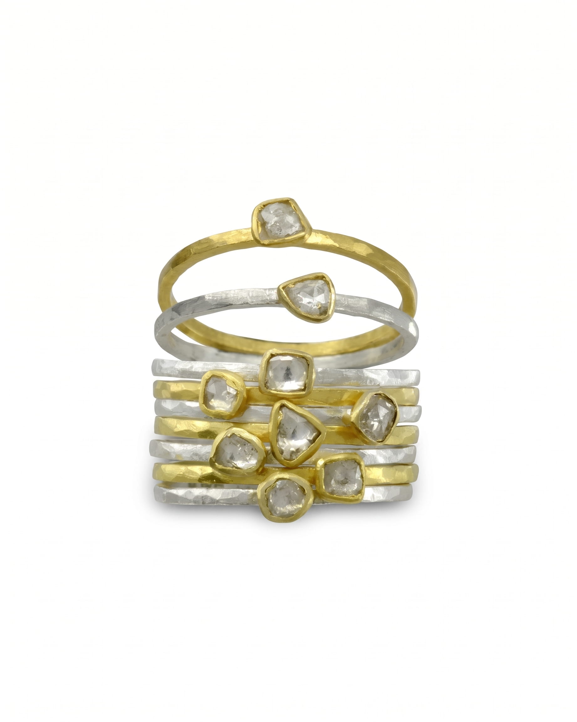 Gold and silver stacking rings with rough diamond slices.