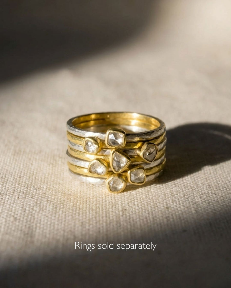 Silver and 18ct yellow gold stacking rings with rough diamonds.