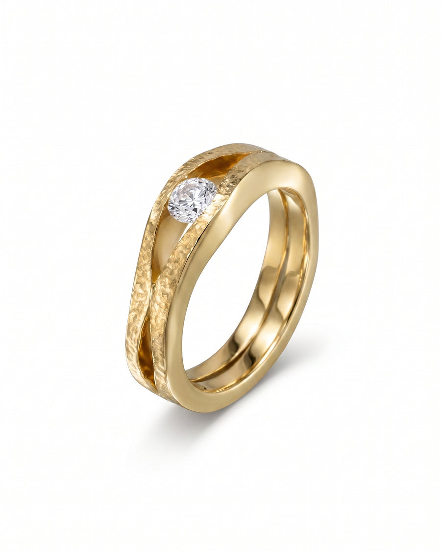 Gold rough hammered diamond trap solitaire engagement ring.