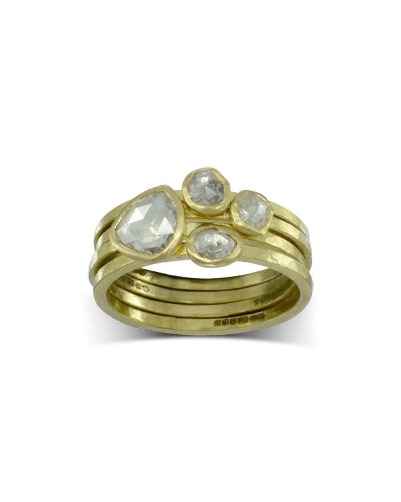 Handmade gold stacking rings with rough hammered finish and rose cut diamonds