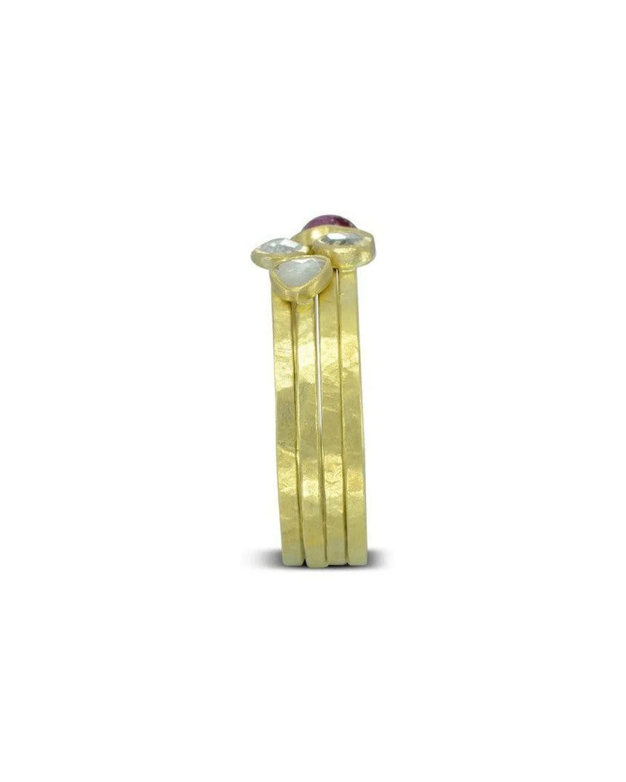 Stacked hammered gold rings with rose cut diamonds and organic, textured design