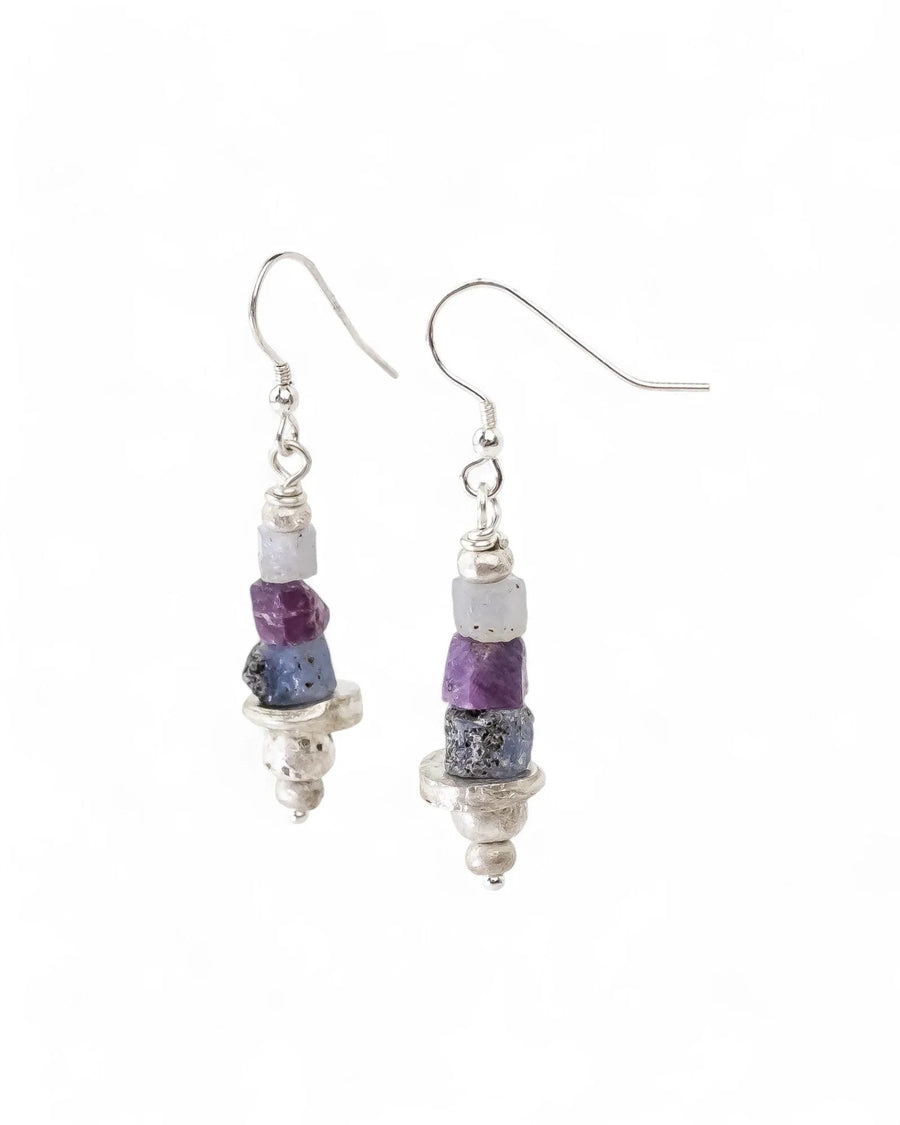 Rough sapphire and silver drop earrings with purple and blue stones.