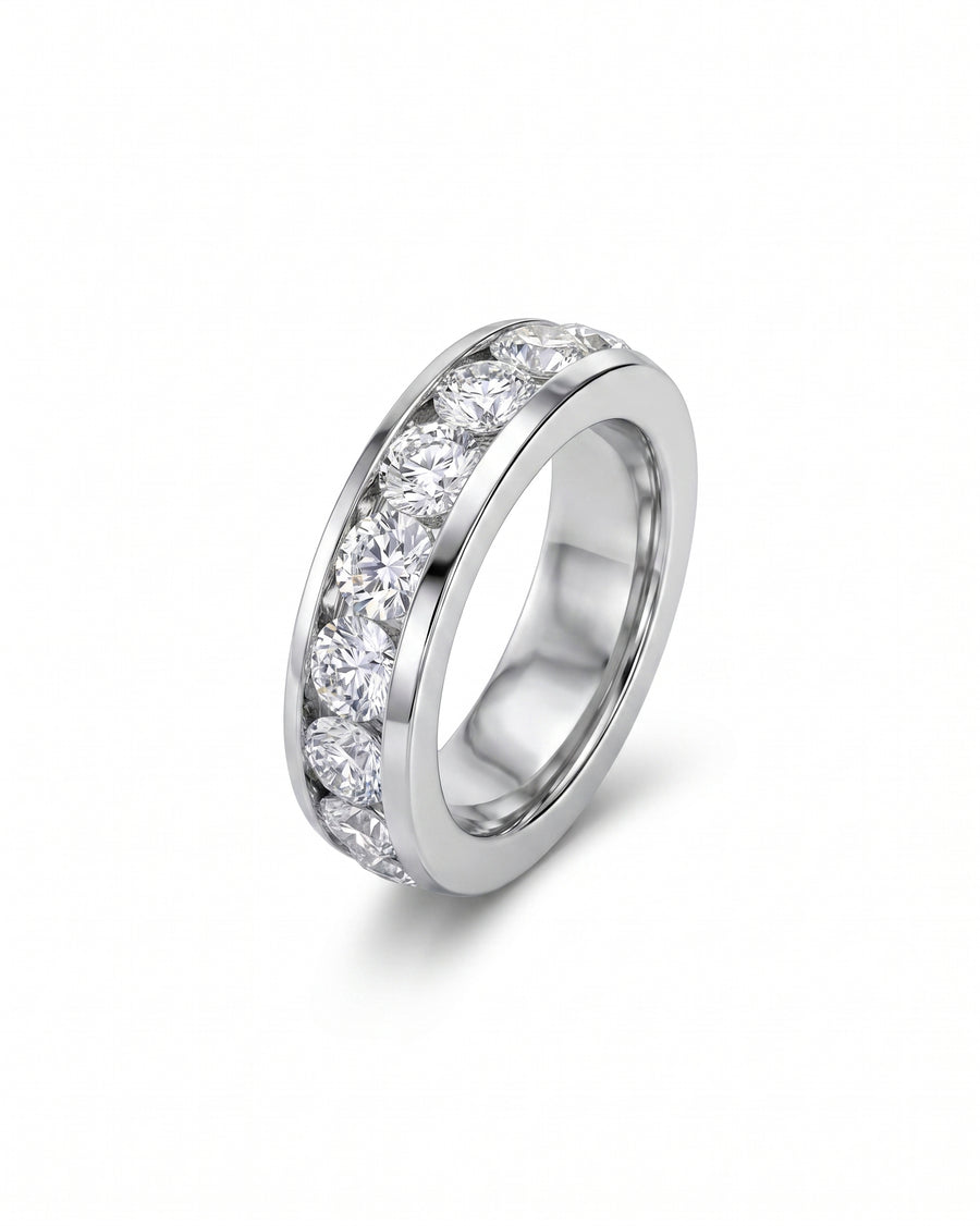White gold ring with channel-set round brilliant cut diamonds.
