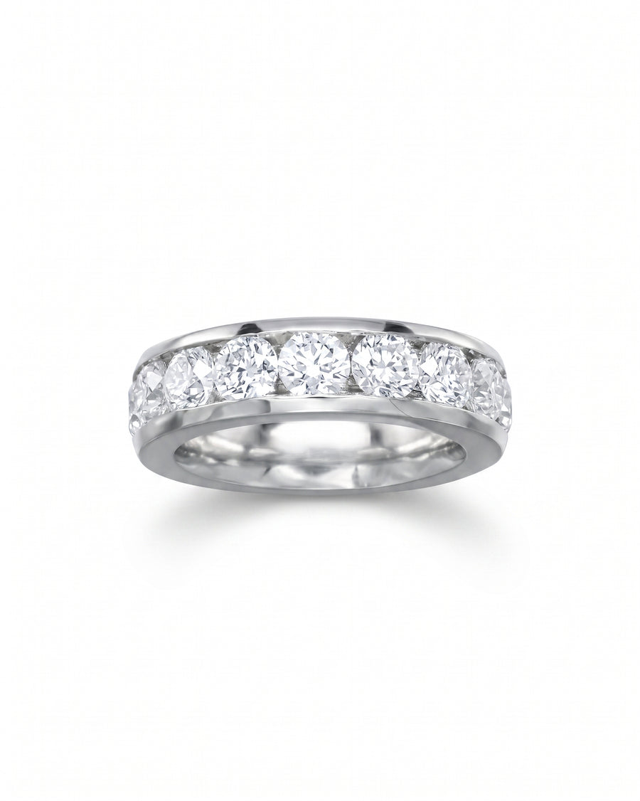 White gold ring with channel-set round brilliant cut diamonds.