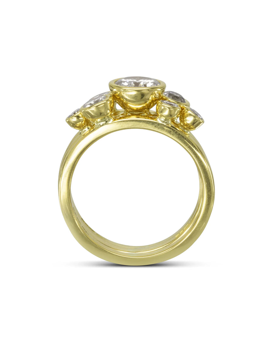 Yellow gold stacking rings with round brilliant diamonds.