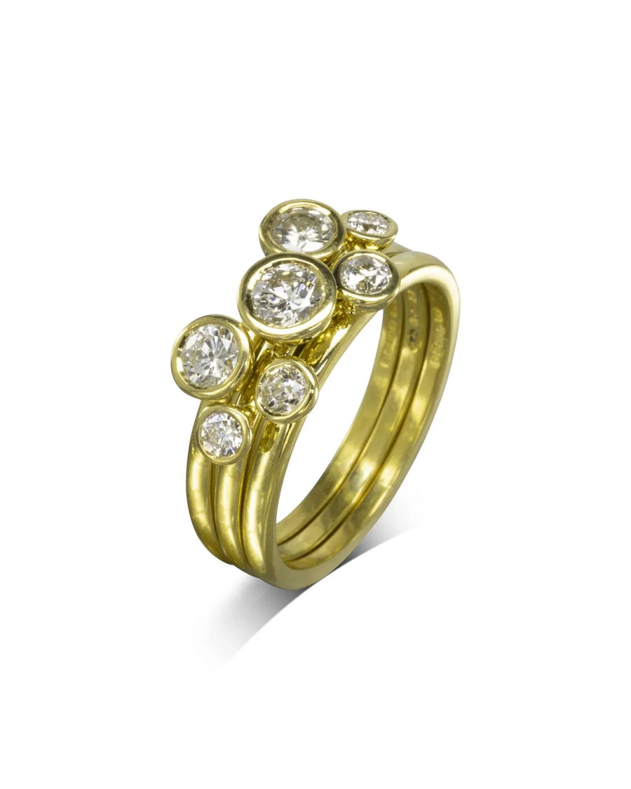 Yellow gold stacking rings with round brilliant diamonds.