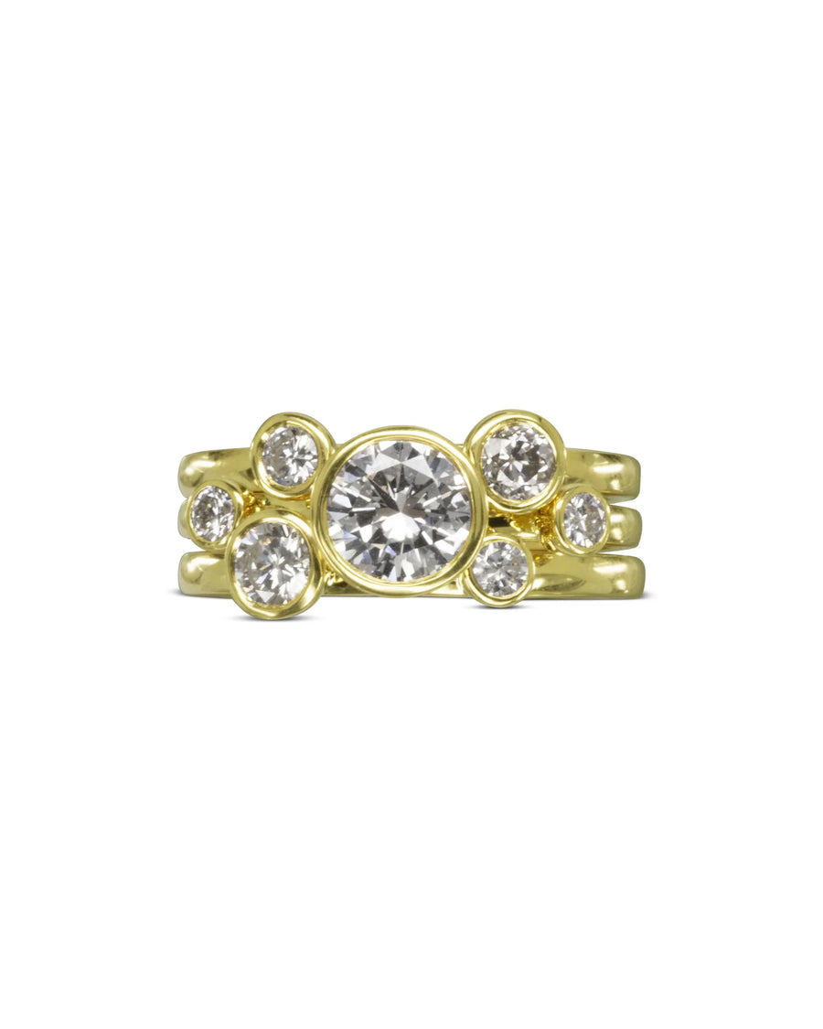 Yellow gold stacking rings with round brilliant diamonds.