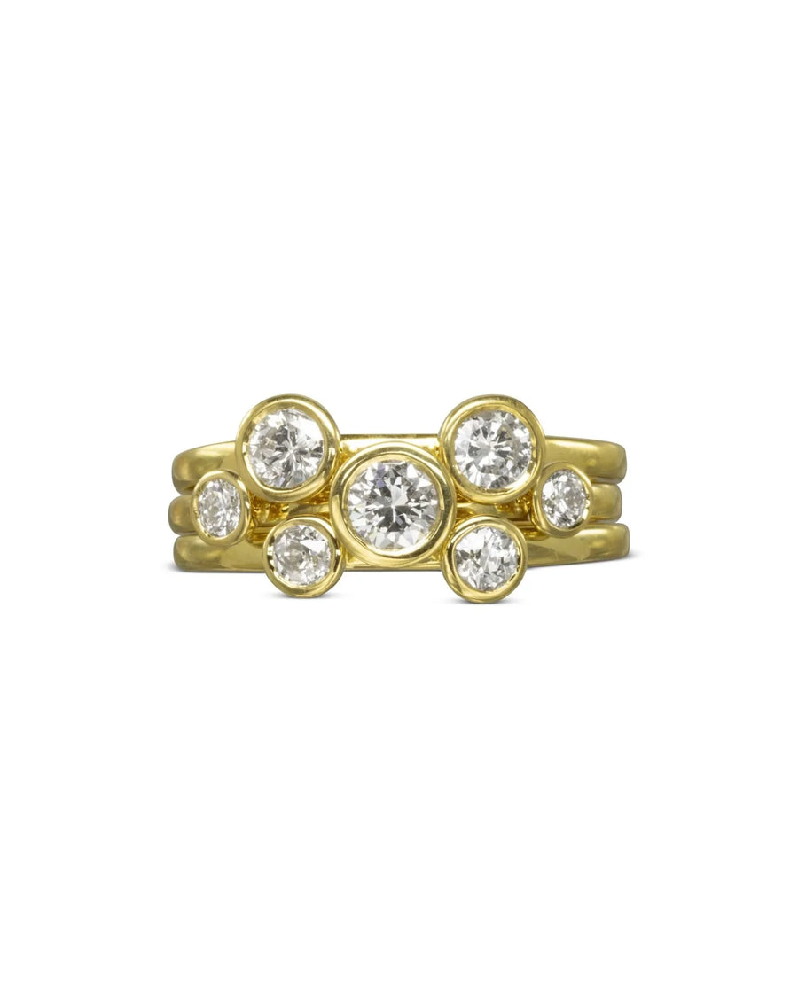 Yellow gold stacking rings with round brilliant diamonds.