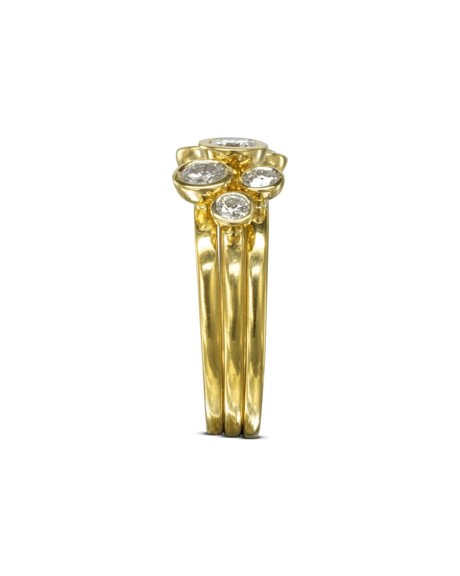 Yellow gold stacking rings with round brilliant diamonds.