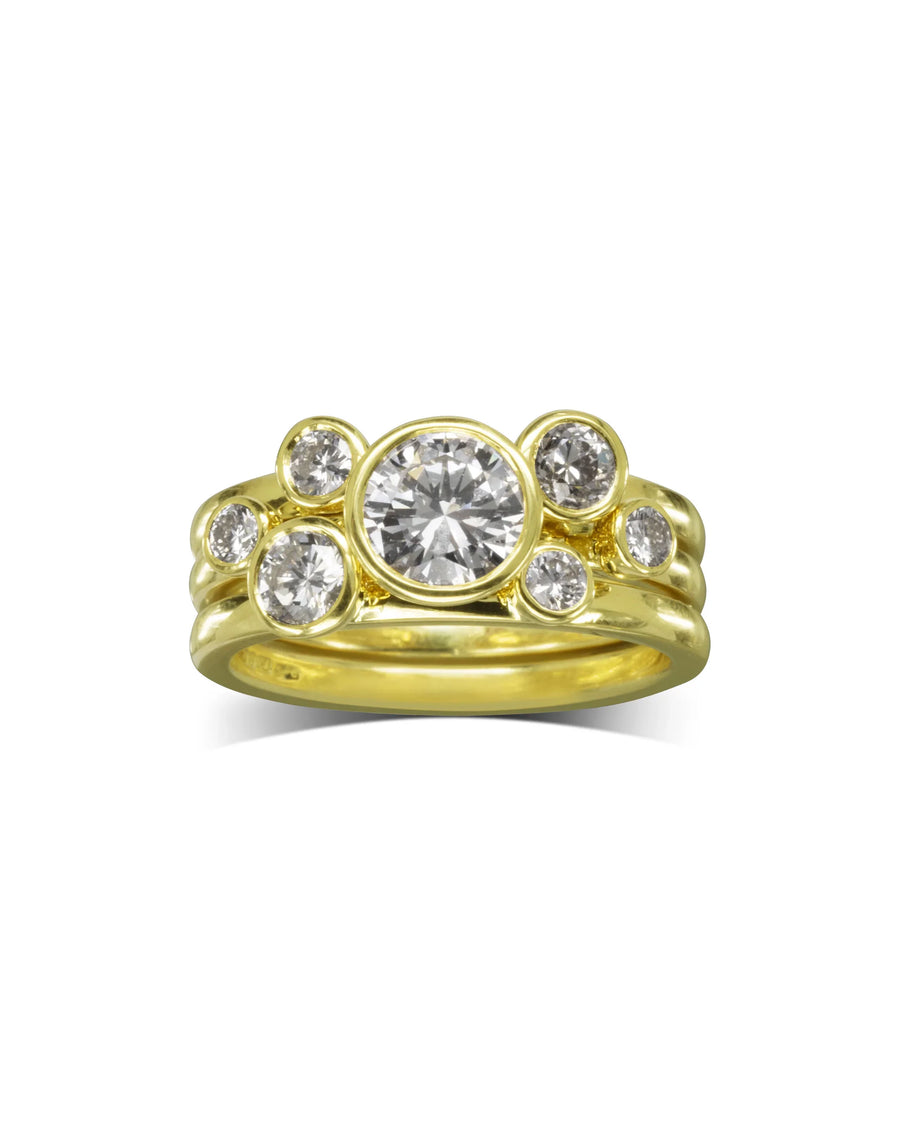 Yellow gold stacking rings with round brilliant diamonds.