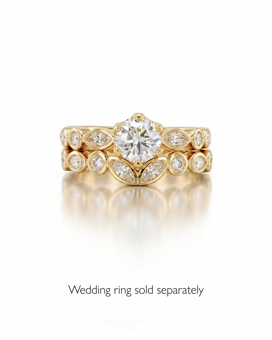 Gold round cut crown set engagement ring with diamond accents.