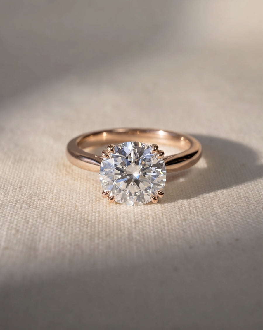 18ct rose gold engagement ring with a round cut lab grown diamond.