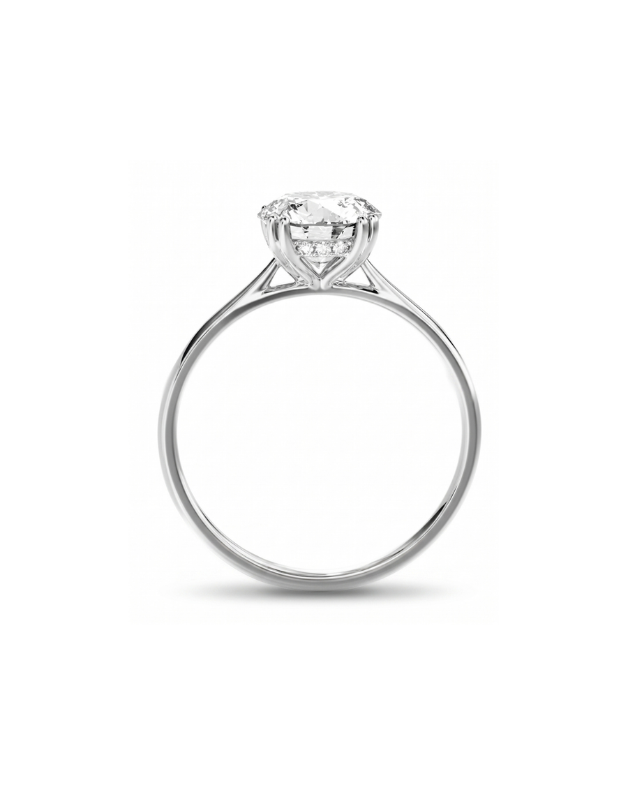 White gold round cut hidden halo engagement ring with a large center diamond.