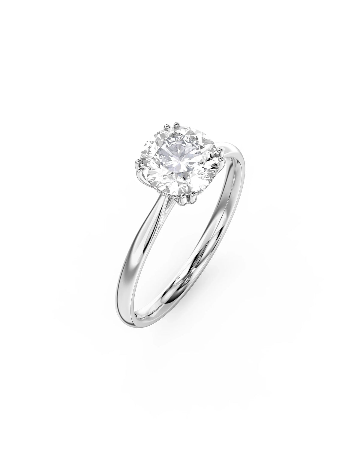Round cut diamond engagement ring with a hidden halo on a polished white gold band.