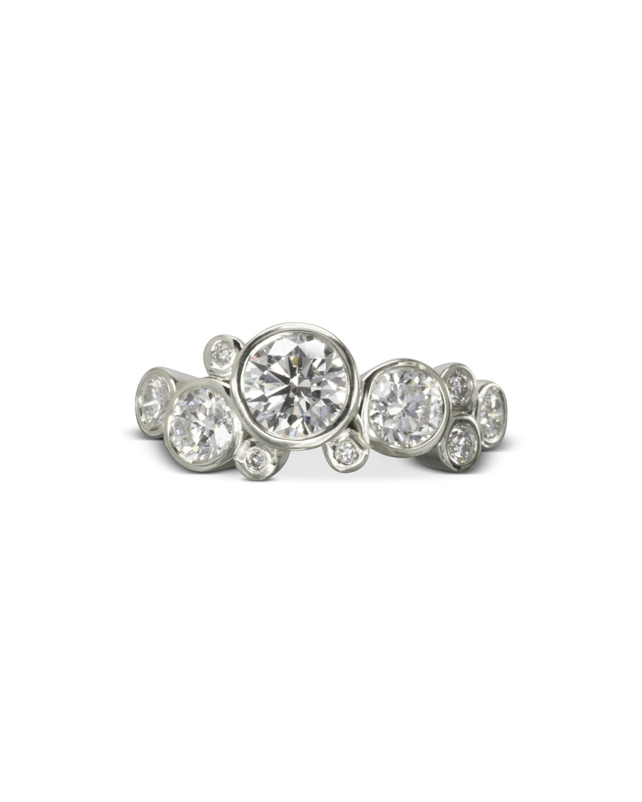 Silver ring with round cut diamonds in a bubble design.