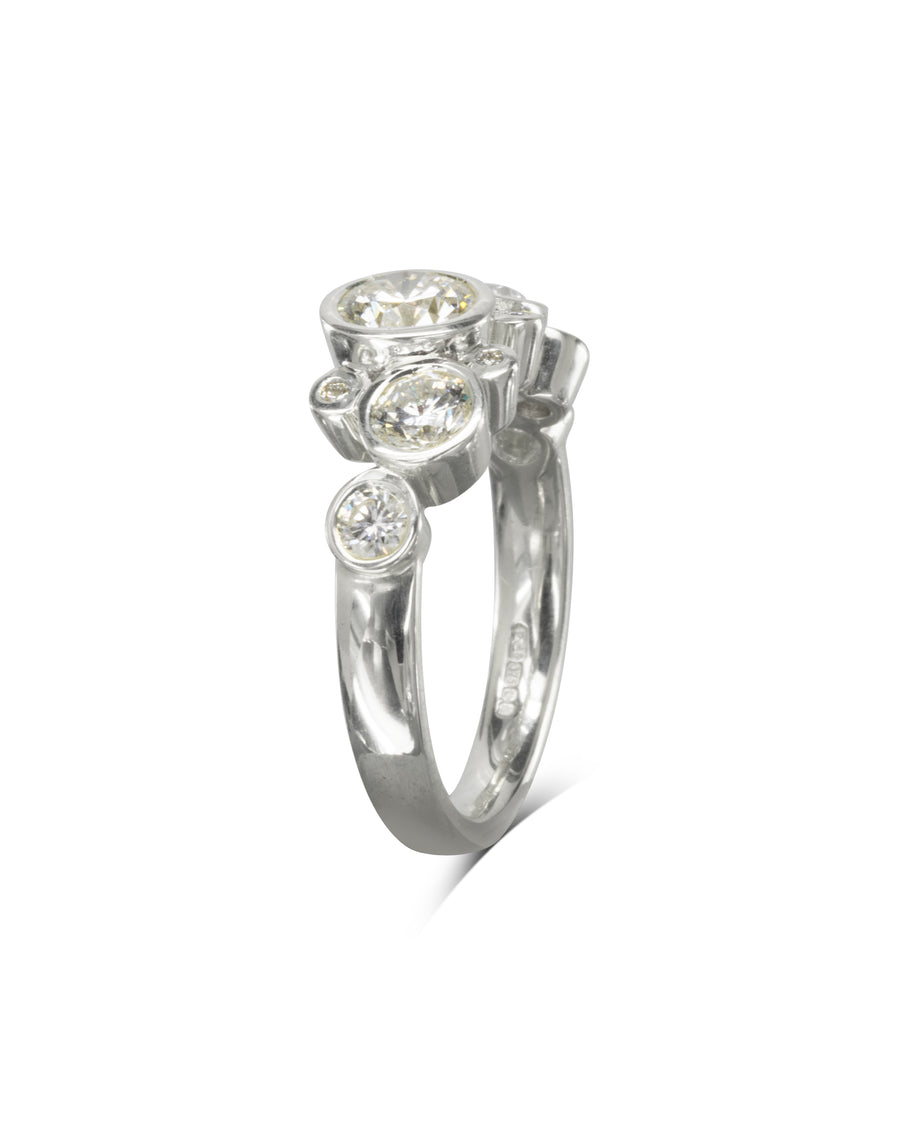 Silver engagement ring with round cut diamonds in a water bubbles design.