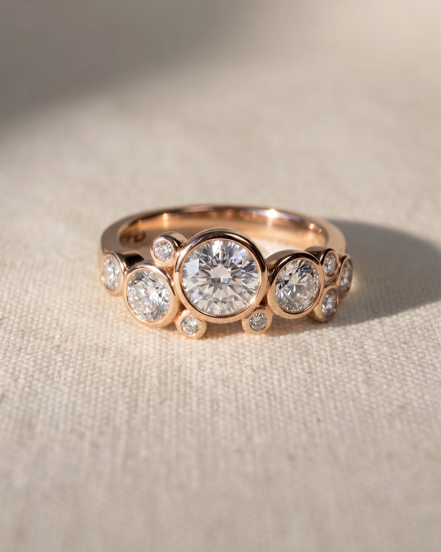 18ct rose gold engagement ring with round cut lab grown diamonds in a bubble design.