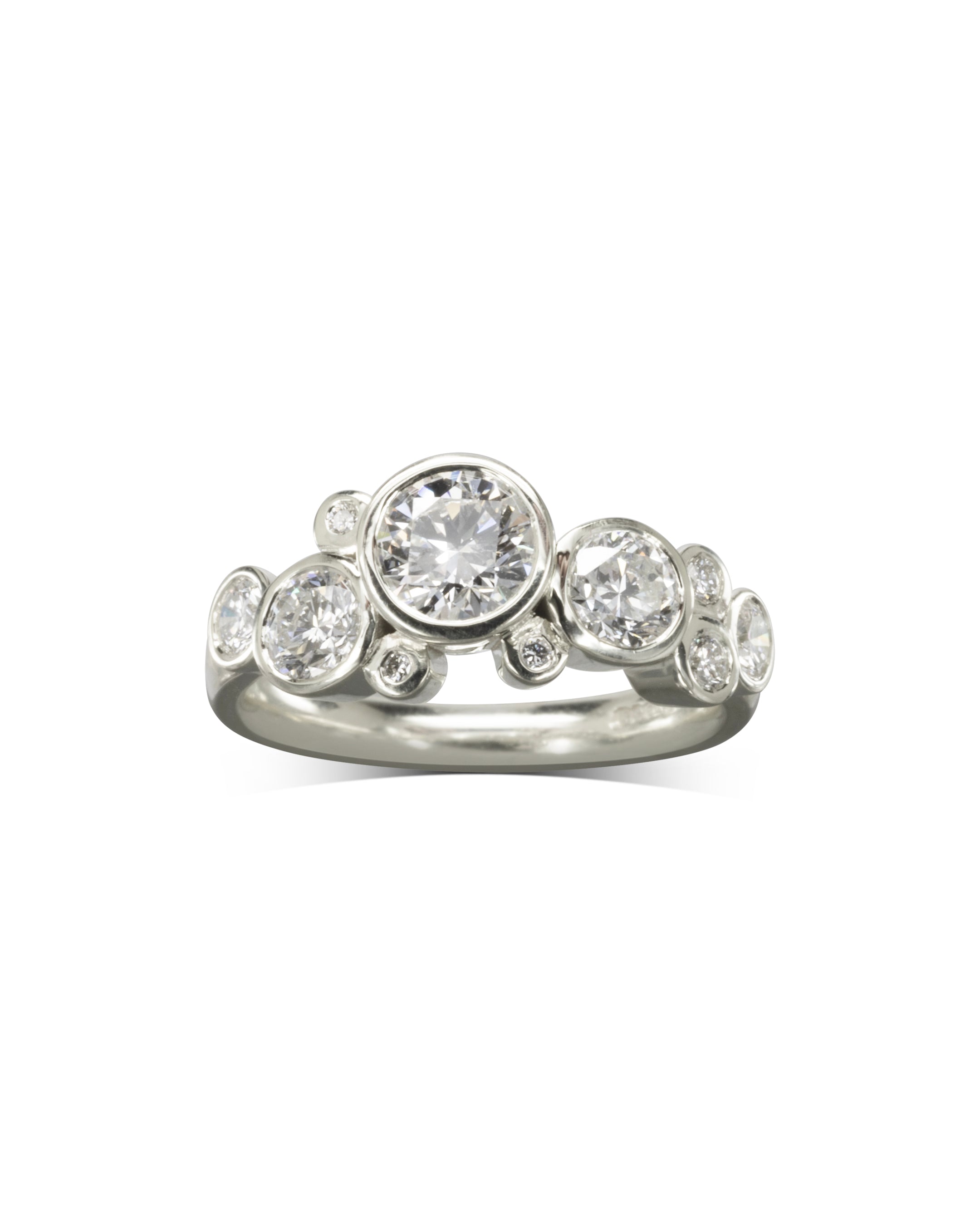 Silver engagement ring with round cut diamonds in a bubble design.