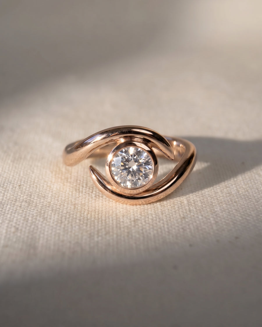 18ct rose gold spiky engagement ring with a 1ct lab grown round cut diamond.