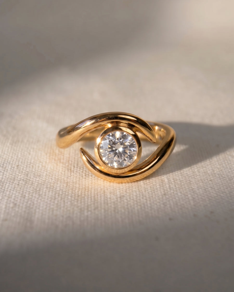 18ct yellow gold spiky engagement ring with a round cut lab grown diamond.