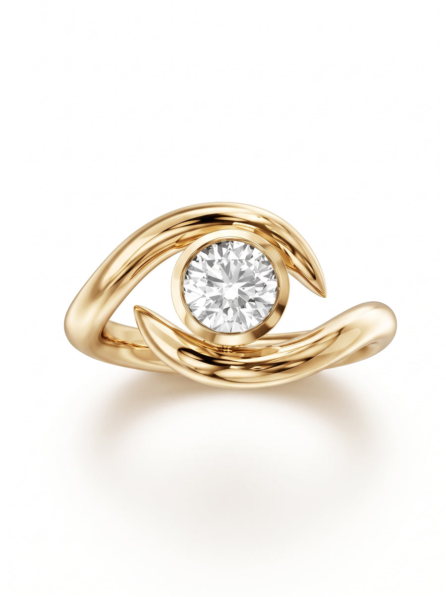 Round cut diamond engagement ring in 14k gold with a spiky, swirling bypass band design.