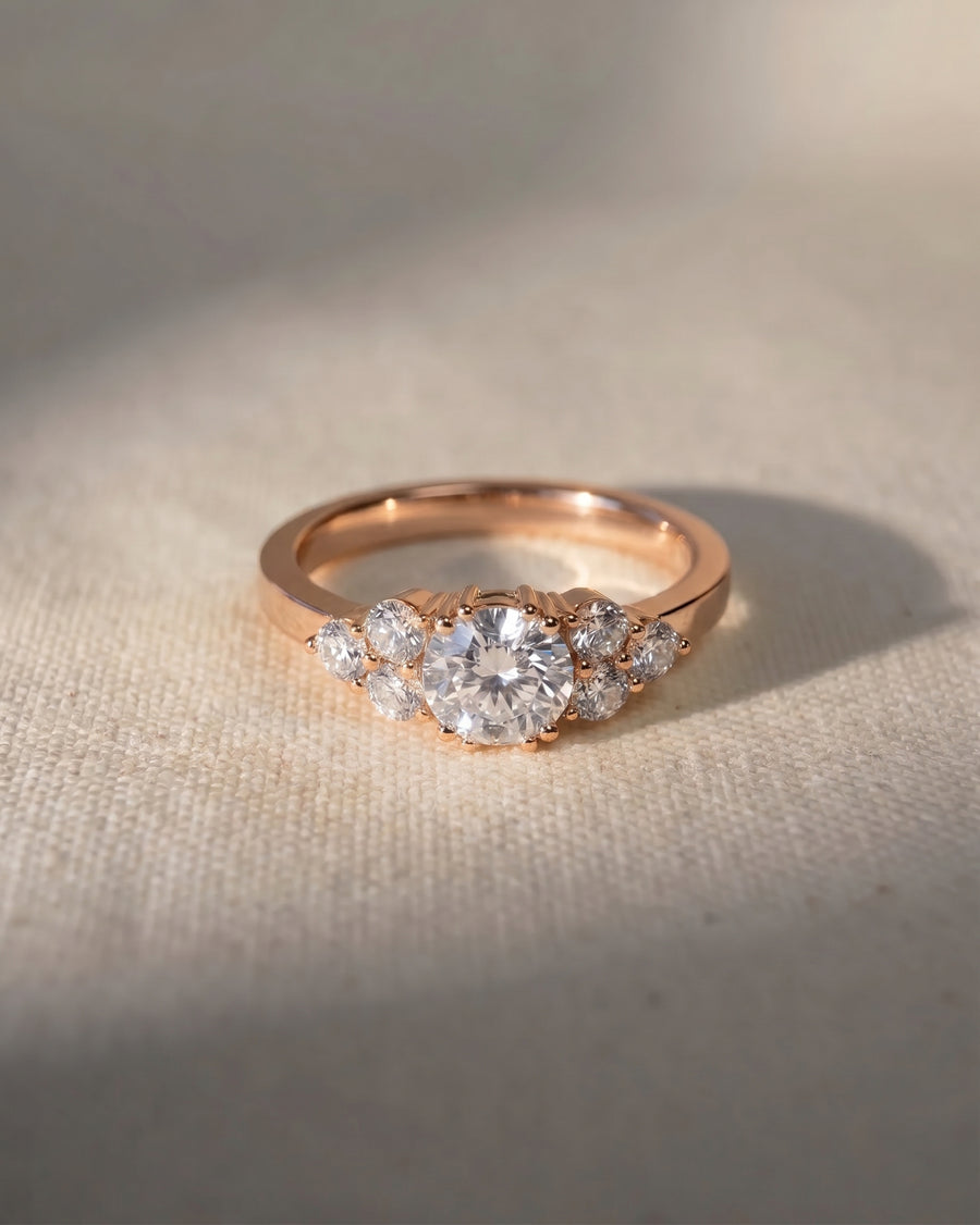 18ct rose gold engagement ring with a round cut lab grown diamond and trefoil claw setting.